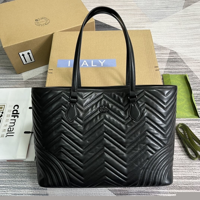 G*u*i shopping bags